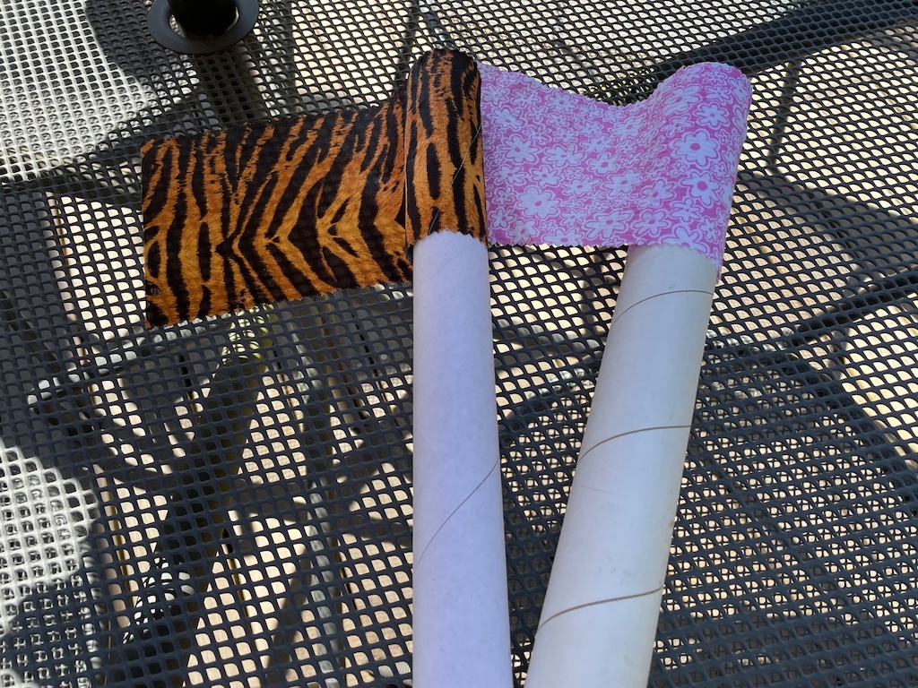 Make flags for capture the flag using plastic wrap rolls and fabric scraps.