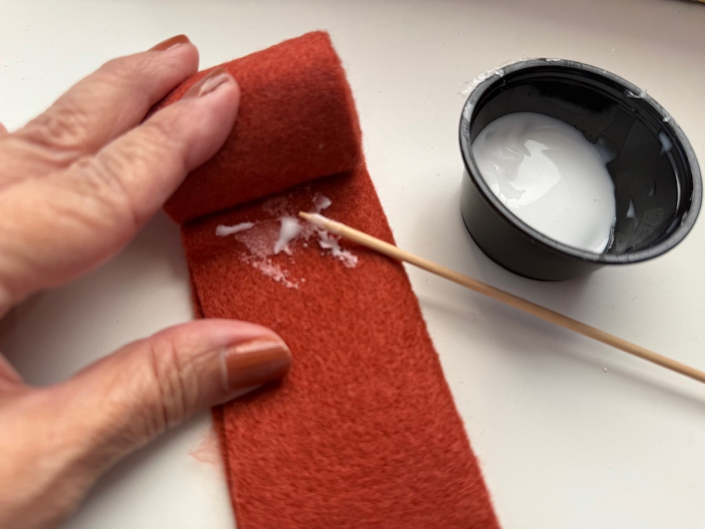 Roll felt strip and glue in place to make the stem.