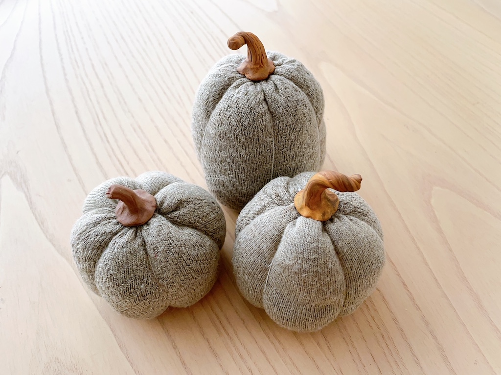 These pumpkins are made by cutting and stuffing old socks. They make a great table decorations for the fall. Older kids can help.