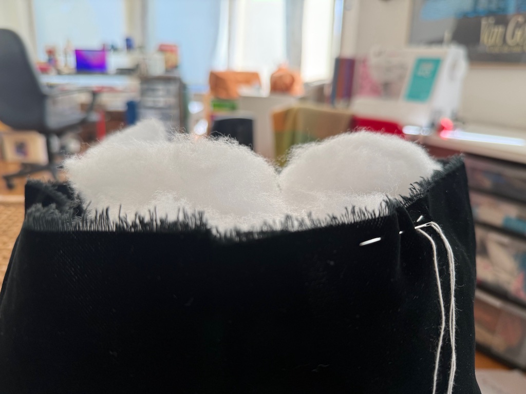 Sew 1/2-inch from the edge of the top of the pumpkin with a running stitch to close.