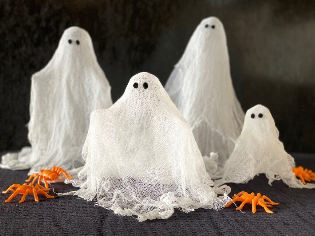 Ghosts made with cheesecloth are an easy Halloween craft.