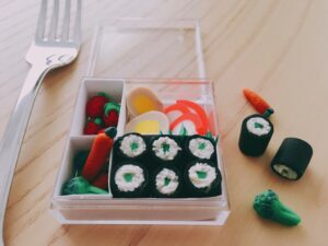 Tiny food made from polymer clay for a doll's bento lunch.