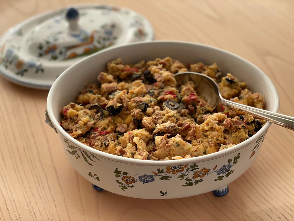 Portuguese Thanksgiving Stuffing is studded with pimentos and olives. It is served in a French soup tureen.