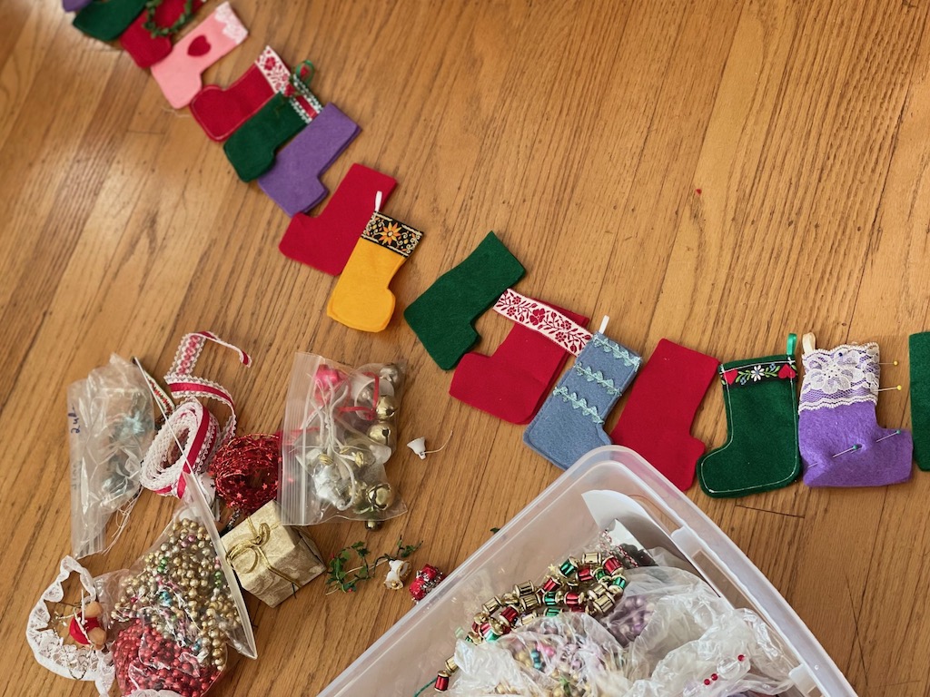 To turn tiny stockings into an Advent calendar, lay out all the stockings to determine how each will face. 