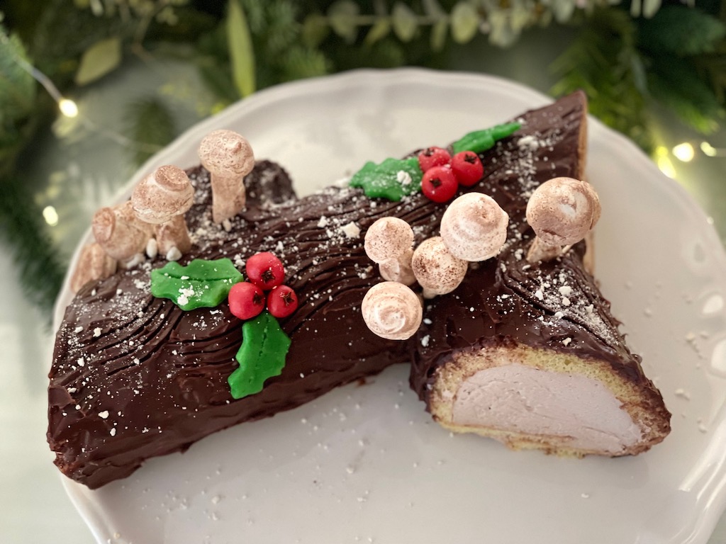 A home-baked Bûche de Nöel is actually the evening's dessert, although the kids prefer eating the cookies off the centerpiece. 