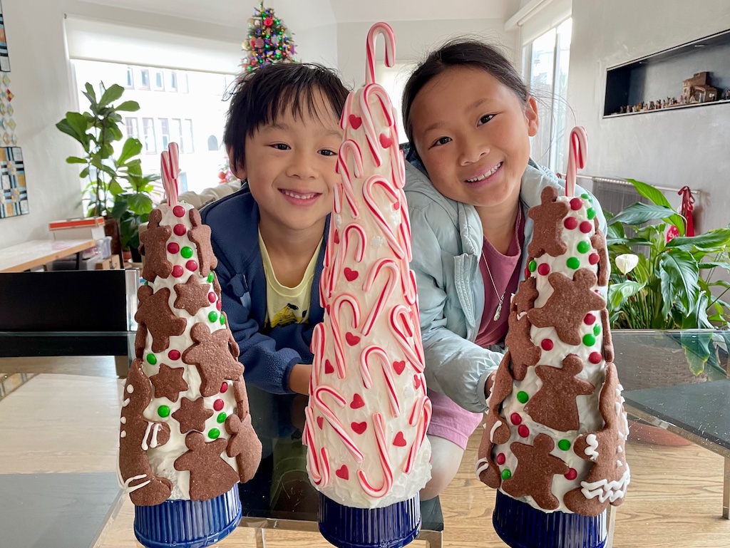 Kids admire the cookie trees, soon to be the Christmas centerpiece. They  can't wait to consume the decorations after dinner.