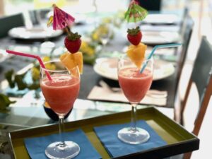Fruit juice gets fancy with fruit skewers and paper umbrellas for this luau party.