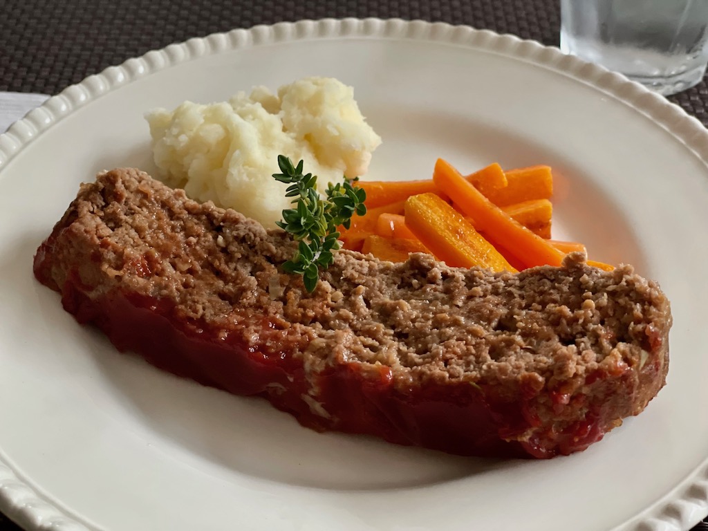 Meatloaf, mashed potatoes and buttered carrots make a good Friday night family dinner.