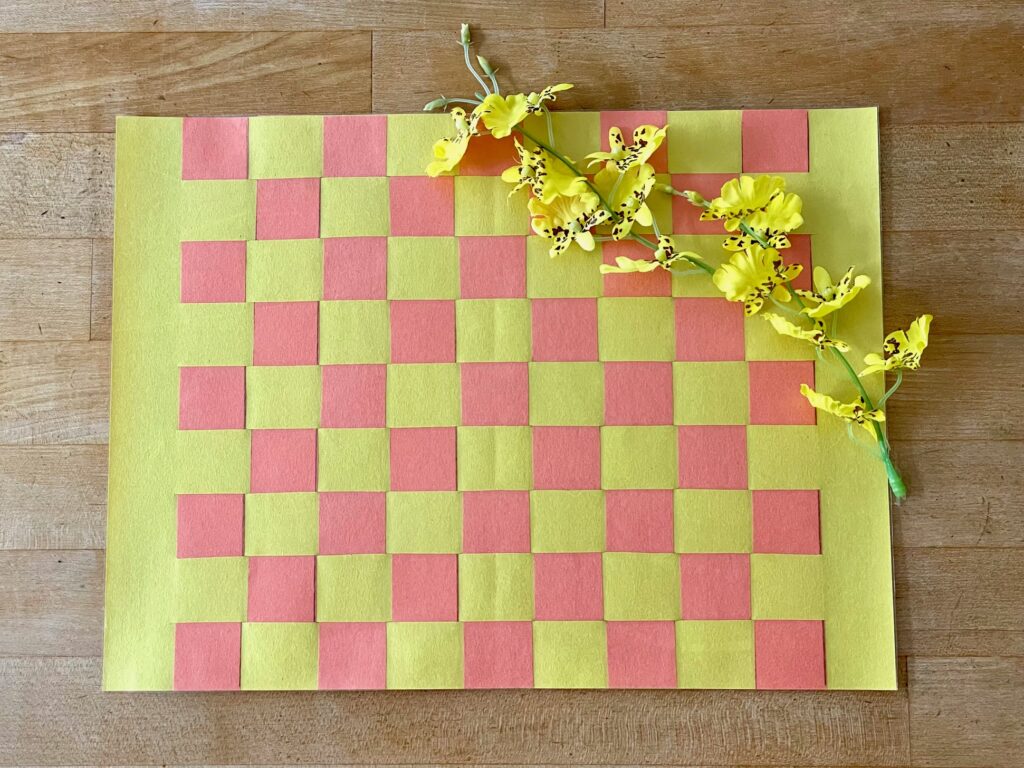 Another great kids' luau activity: making woven placemats with construction paper.