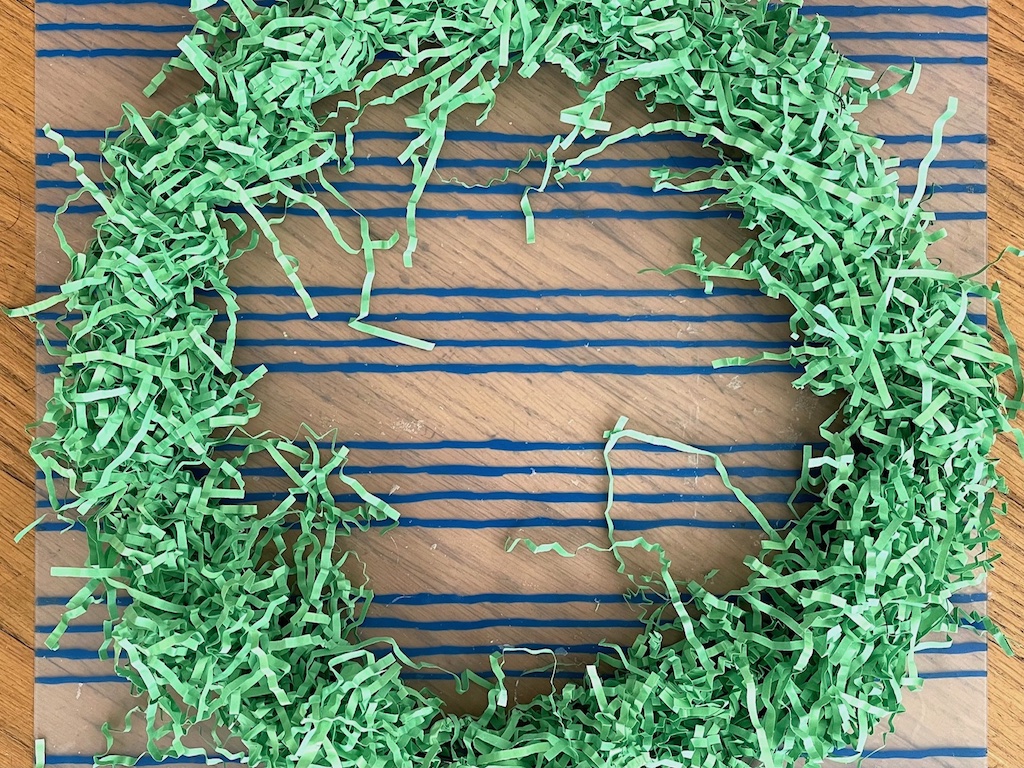 Wire wreath ring is completely covered.