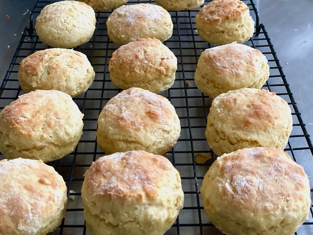 Irish scones on a cooling rack sends out mouthwatering aromas.