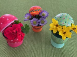 Decorate plastic eggs and turn them into vases for this Easter craft project.