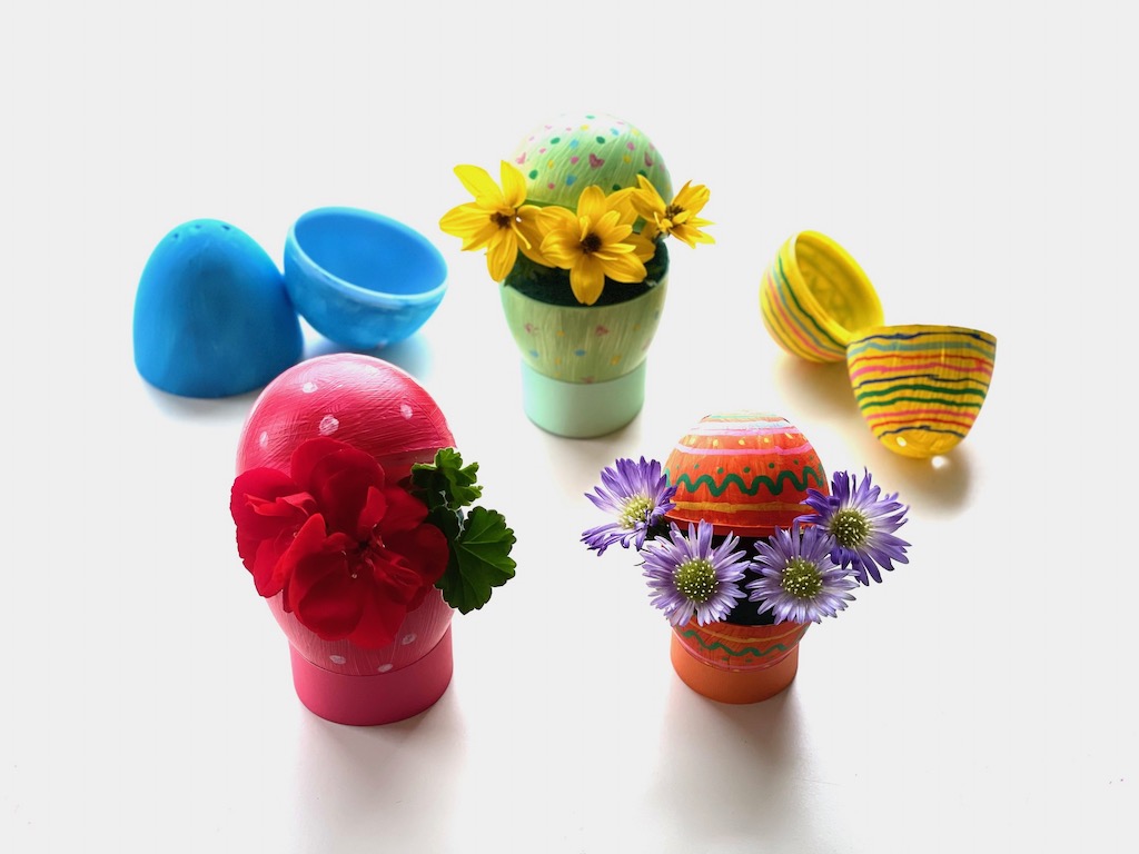Plastic egg Easter crafts are easy and fun to do when you paint and decorate the eggs. Add floral foam and arrange fresh flowers.