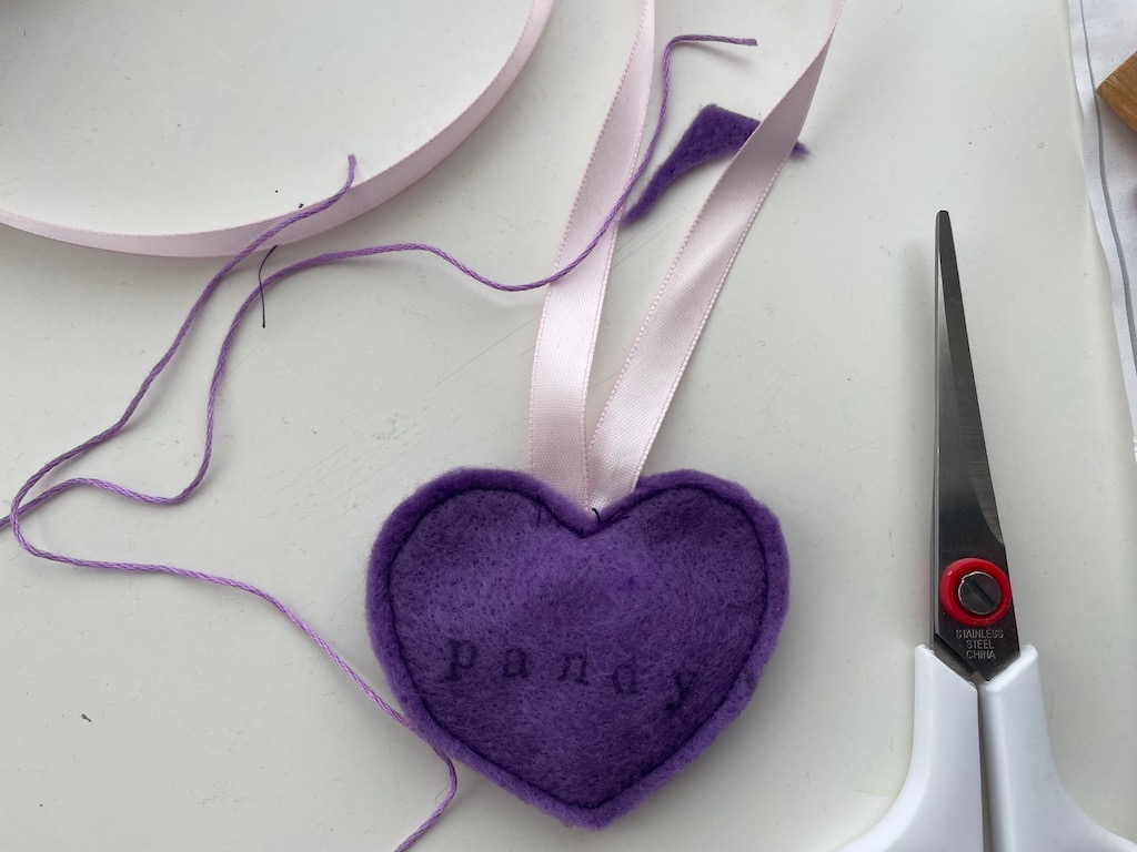 The heart can simply be machine-stitched together. For a fancier finish, embroider the edge of the heart with a blanket stitch.