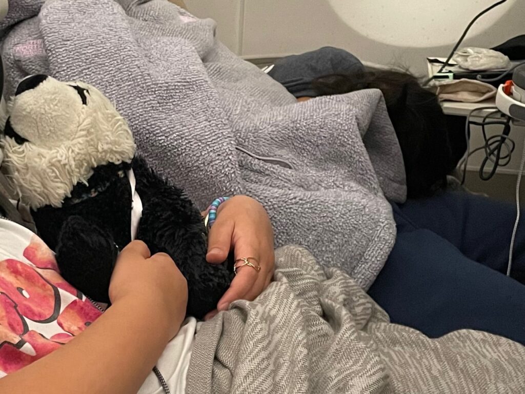 Bring out a favorite stuffie for sleep time on an airplane, but return it to the backpack afterward to keep from losing it.