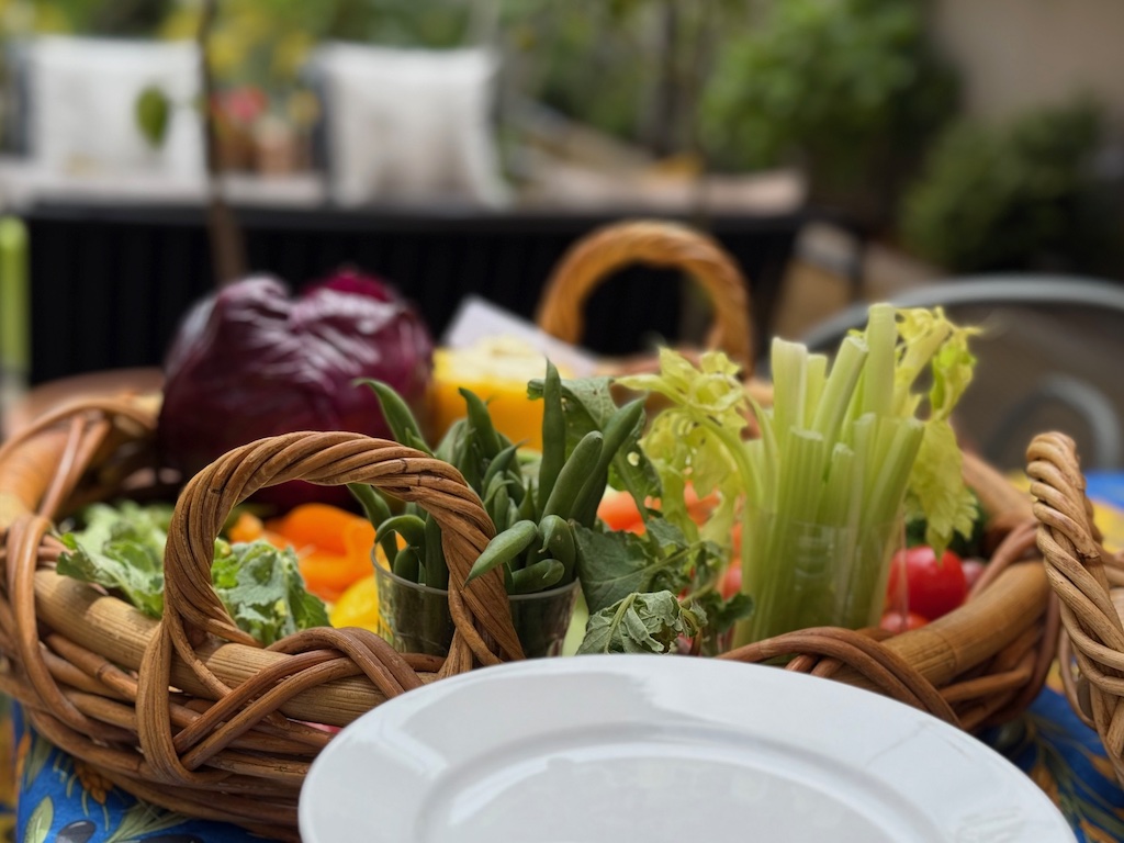 Crudité basket features beans and celery in glass cups to create height.