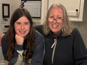 Grandma Sharon and her granddaughter in the kitchen. They bond over cooking.