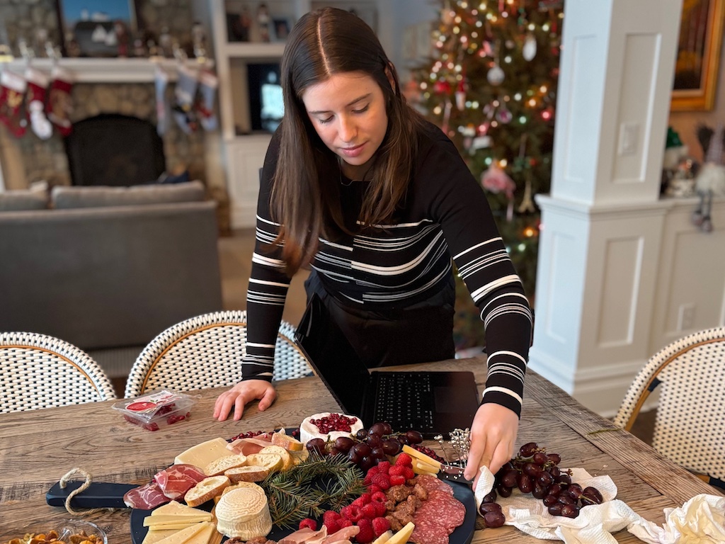 Sharon's granddaughter prepares the charcuterie board for the holiday table.