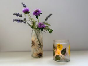 Two ways to use pressed flower jars: as a vase and as a candle holder for a tea light.
