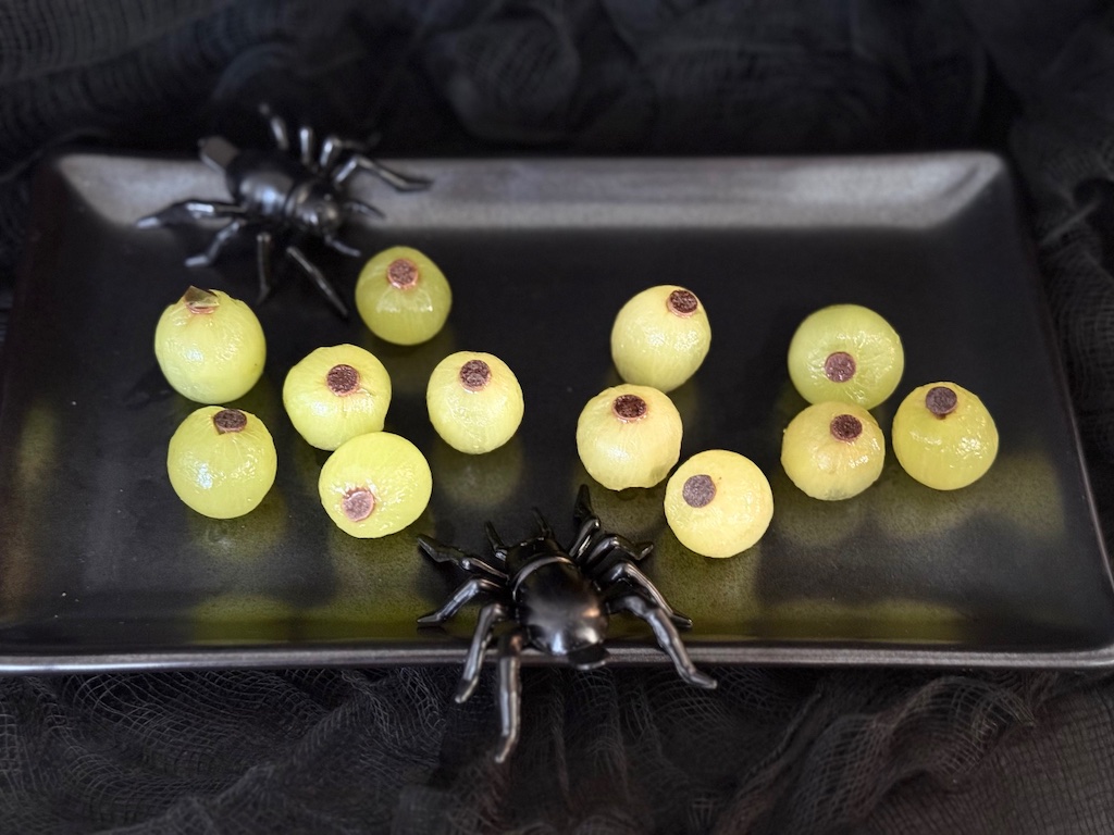Peeled grapes, each embedded with a mini chocolate chip. make creepy eyeballs.