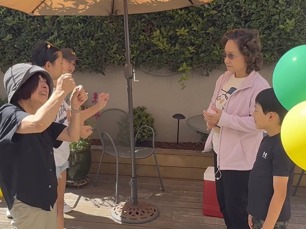 Playing Lemonade: Team 1 mimes being a carpenter; Team 2 must guess the occupation being mimed. When Team 2 guesses correctly, Team 1 runs back to base to avoid being tagged.