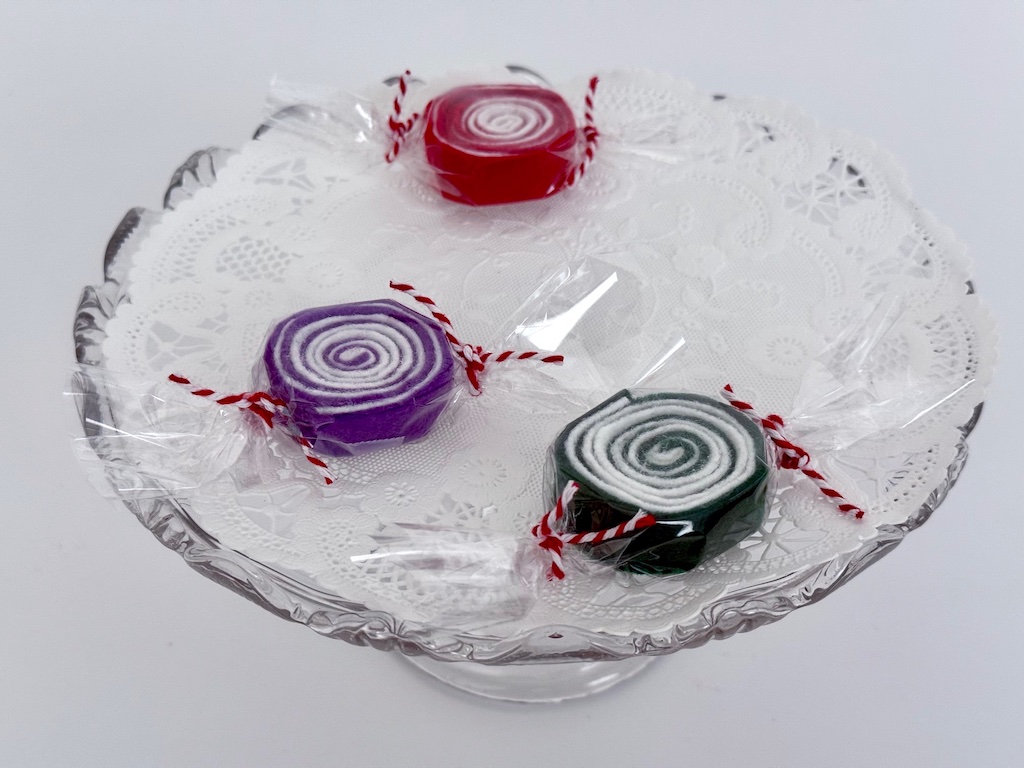 As a variation of lollipops, skip the stick and wrap the felt candy in cellophane.