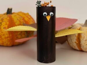 Thankful turkey is made with a toilet paper roll and construction paper. Write your thanks on turkey feathers.