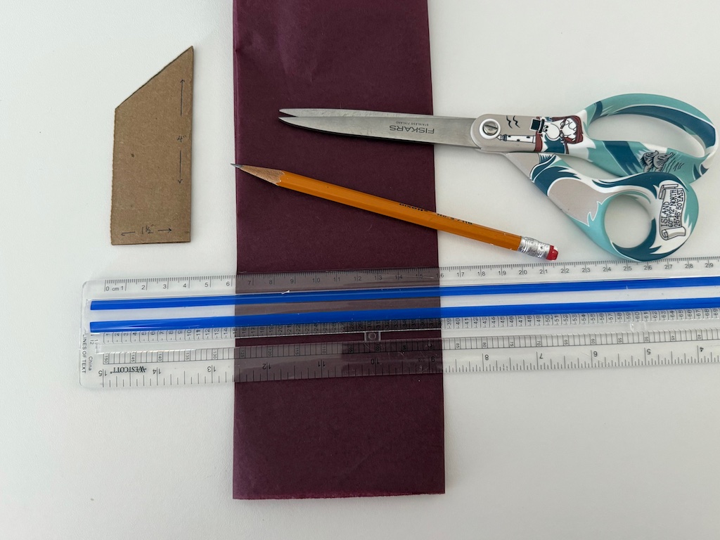 To make a tissue paper crown, fold the tissue paper a few times to give it some heft before cutting.