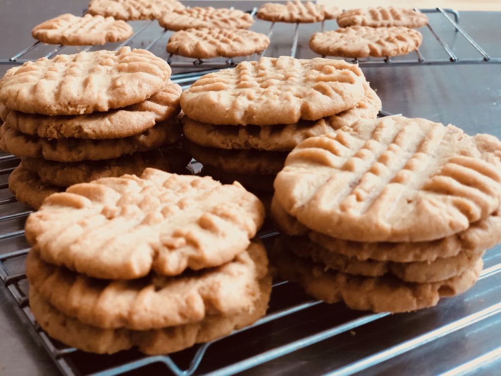 Peanut butter cookies shown here on a rack--and all cookies--benefit by baking at higher temperatures, according to scientists.