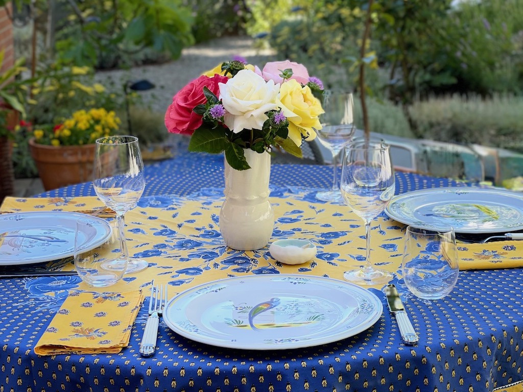 Table set with china, flatware, and linens from France. These will not be given away until the owners can no longer use them.