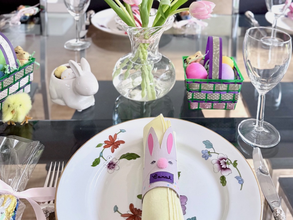 Make bunny napkin rings from toilet paper rolls. Write the guest's name on each bunny. Add ceramic bunnies filled with candy eggs to the table setting, and DIY Easter baskets with real Easter eggs.