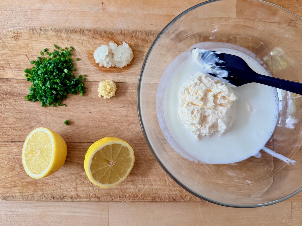 Ingredients for Light ranch dressing: lemon juice, chives, garlic, onion, mayonnaise, and buttermilk.
