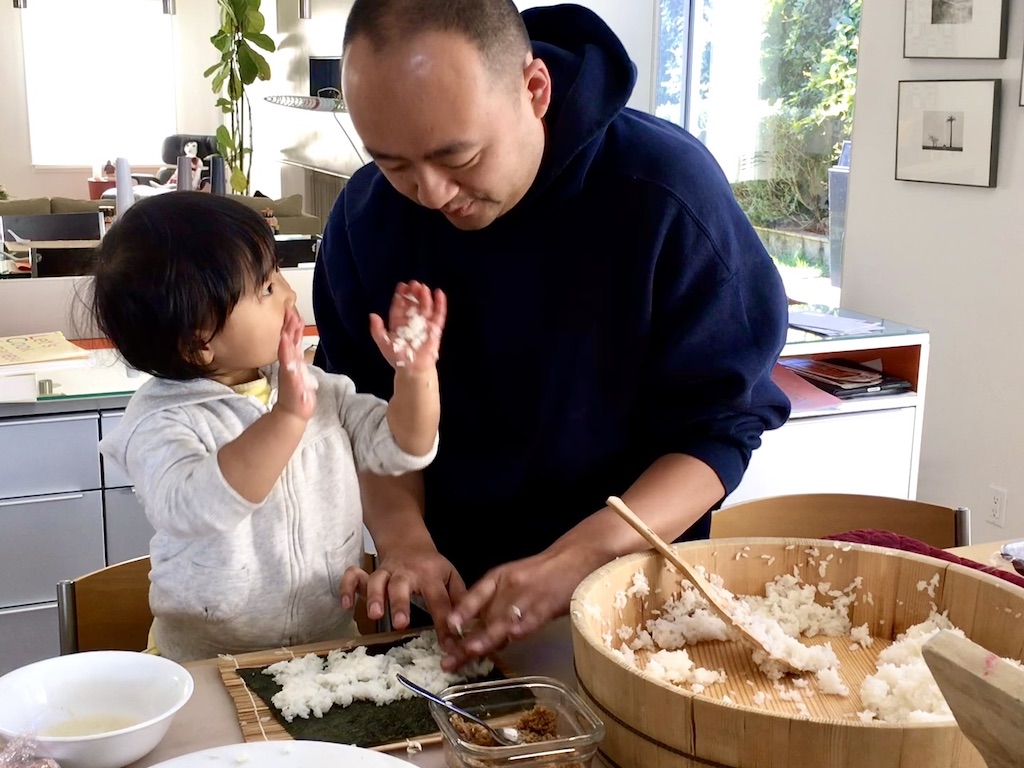 Our family tradition might not be yours but a get-together for the New Year is a good idea for any family. Here, grandchild and her dad make sushi, in the Japanese New Year tradition that our family observes.