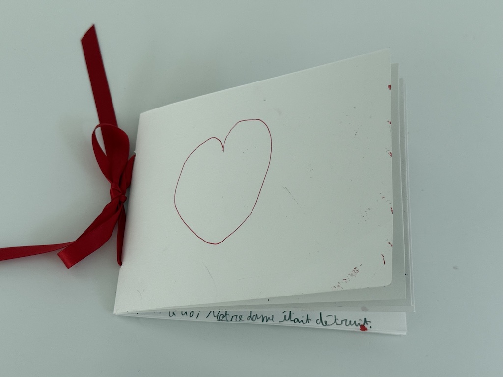Cover of the Father's Day card features a heart. The card is a small book, held together by hole-punching the spine and threading with ribbon.