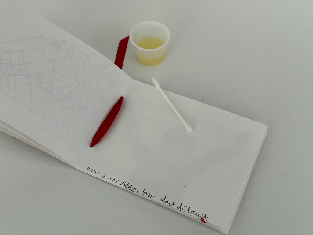This message is written in lemon juice, which has disappeared upon drying. To read the message, dad needs to put the card next to a heat source, which will reveal the message.