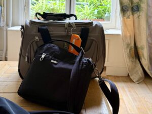 Luggage and handbag packed for travel.