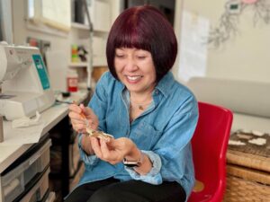 Grandma Sandy, Founder of the blog, "Call Me Grandma!" makes air dry clay ornaments in her craft room.