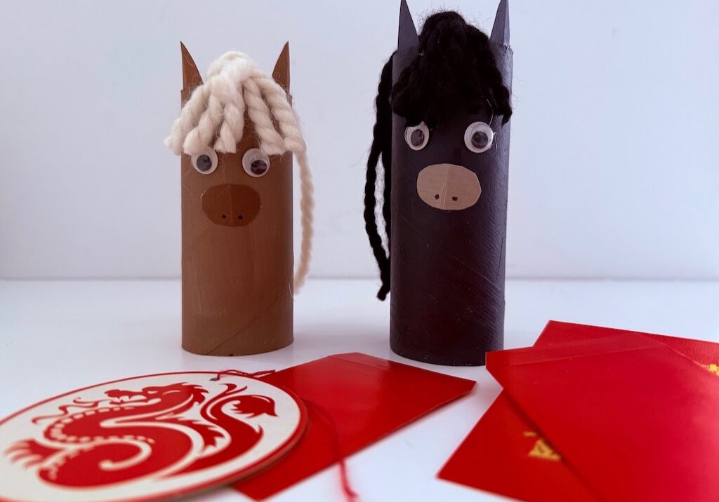 This simple Chinese New Year horse is made with a toilet paper roll, yarn, and construction paper.