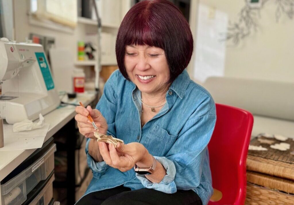 Grandma Sandy, Founder of the blog, "Call Me Grandma!" makes air dry clay ornaments in her craft room.