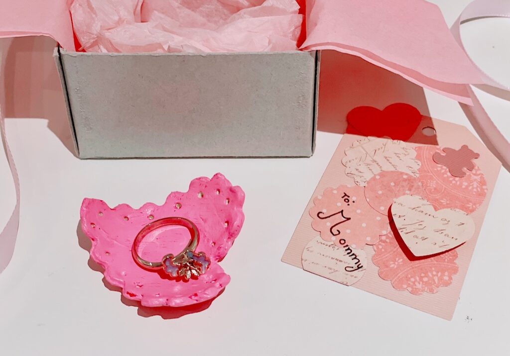 Mother's Day gift is a ring holder made with air dry clay and a homemade gift tag.
