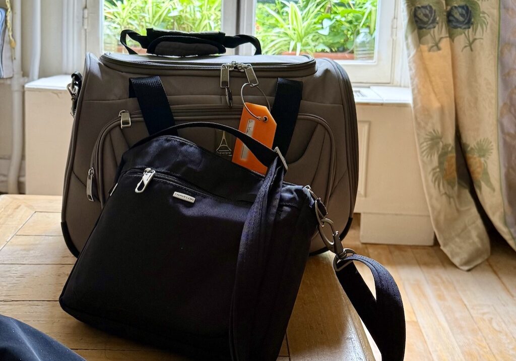 Luggage and handbag packed for travel.