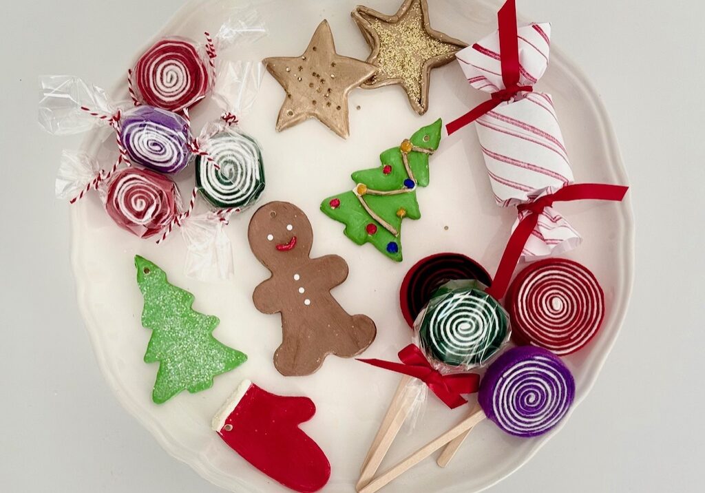 Candy and cookie Christmas tree ornaments are made with air dry clay and felt.