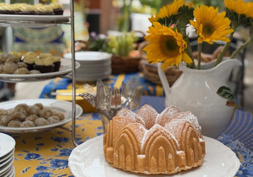A Provençal tablecloth and sunflowers set the theme for a French garden party.